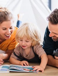 Family reading a book together