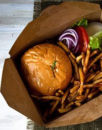 Gourmet burger with fries and toppings