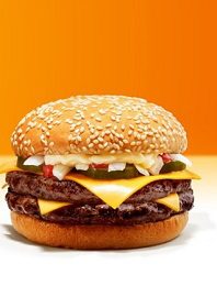 Double cheeseburger against orange background