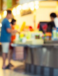 Blurred people at a food counter