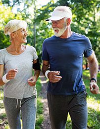 Senior couple jogging in a park