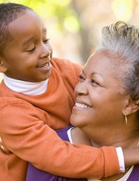 Happy child hugging grandmother