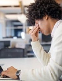 Stressed person at work desk