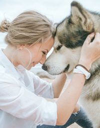 Girl and dog sharing a moment