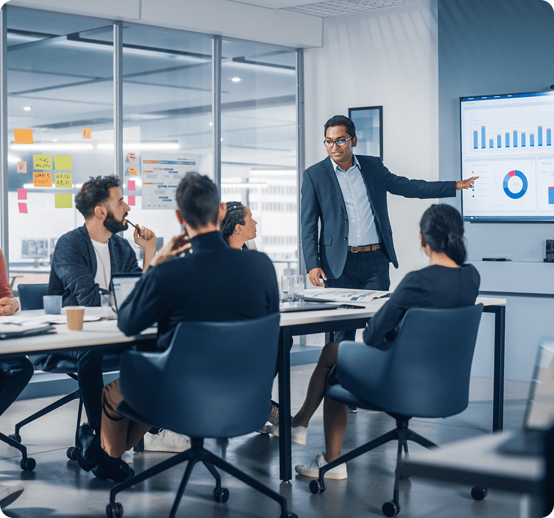 Team meeting with data charts