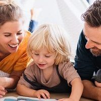 Family reading a book together