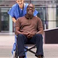 Happy patient and nurse outdoors