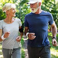Senior couple jogging in a park
