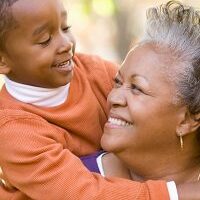 Happy child hugging grandmother