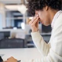 Stressed person at work desk